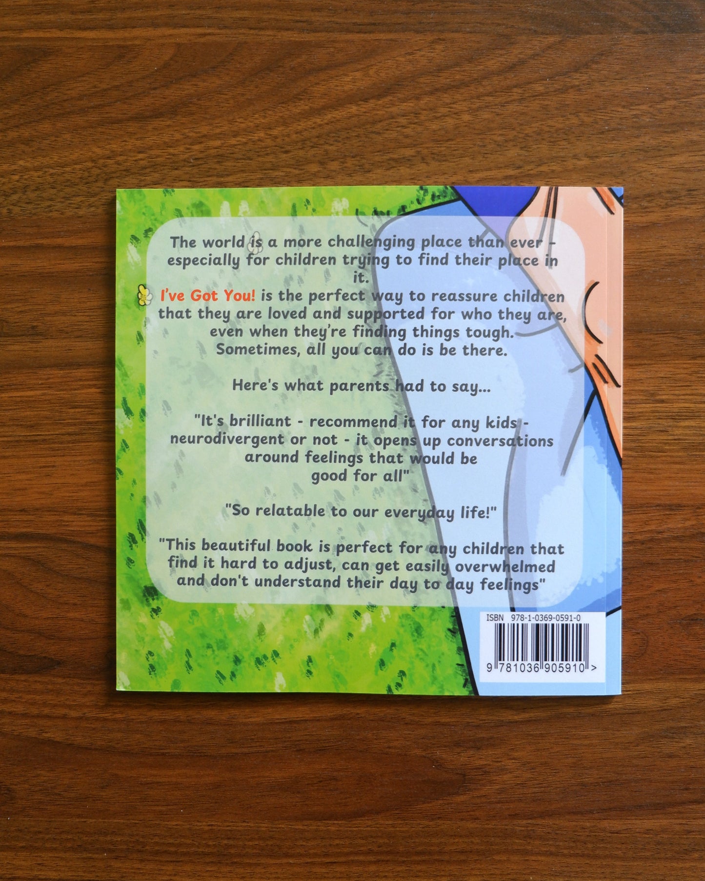 Back cover of a book with text and a barcode on a wooden surface