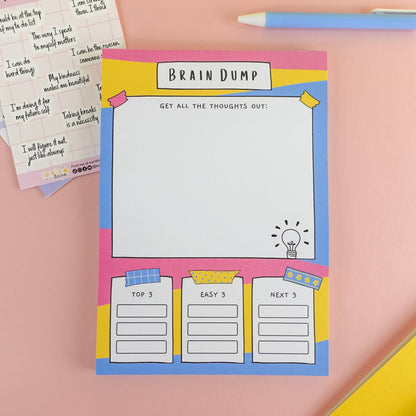 ADHD A5 brain dump notepad with 'Brain Dump' design on a pink background