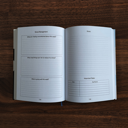 ADHD daily planner open on stress management, notes and important dates tracker, on a wooden desk