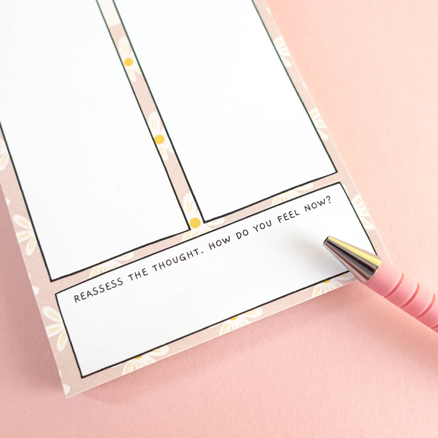 ADHD thoughts vs facts notebook with a pink pen on a pink background