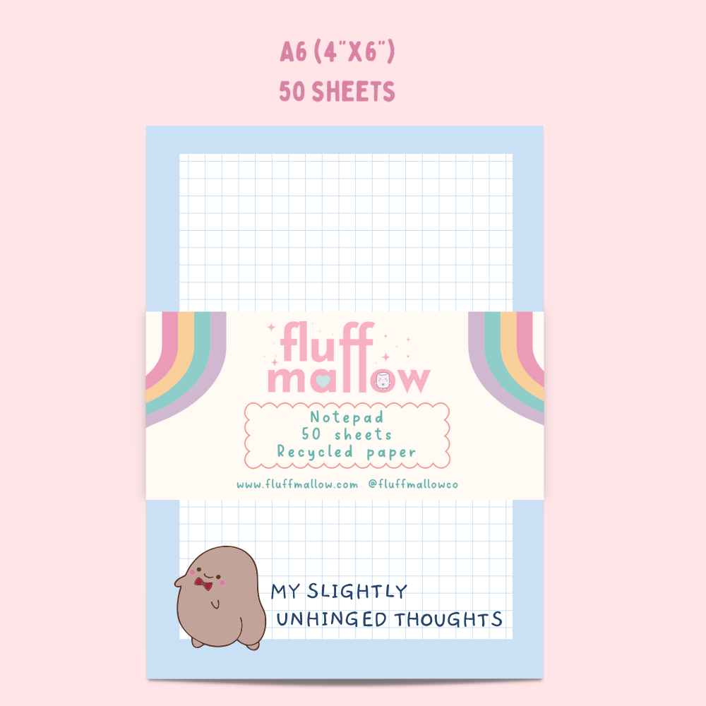Fluff Mallow notepad with grid paper on a pink background